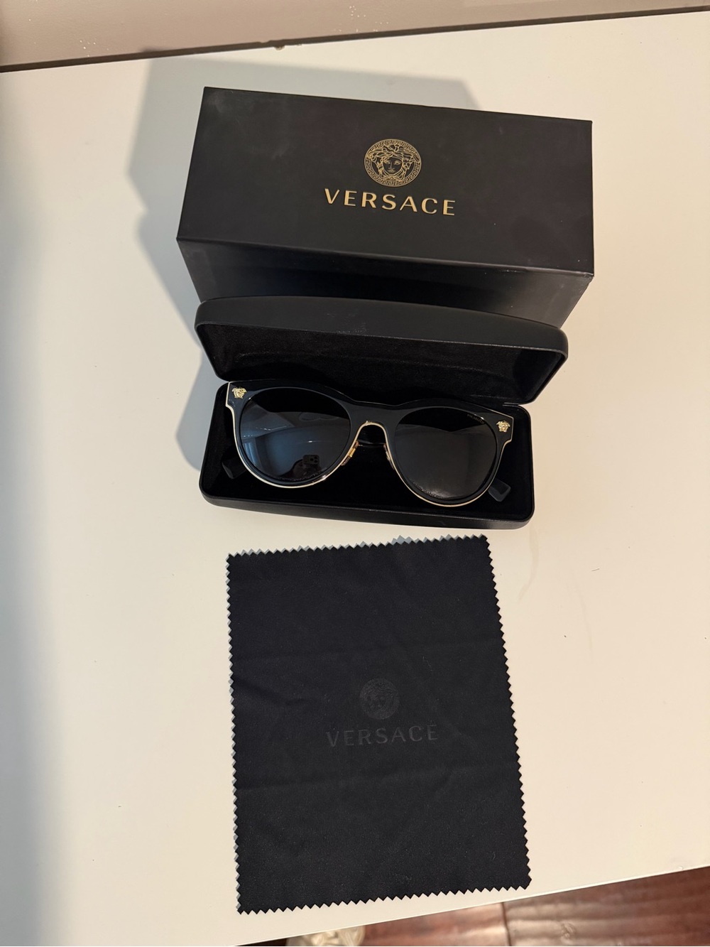 Versace Black and Gold women’s Sunglasses with Dark Lenses
